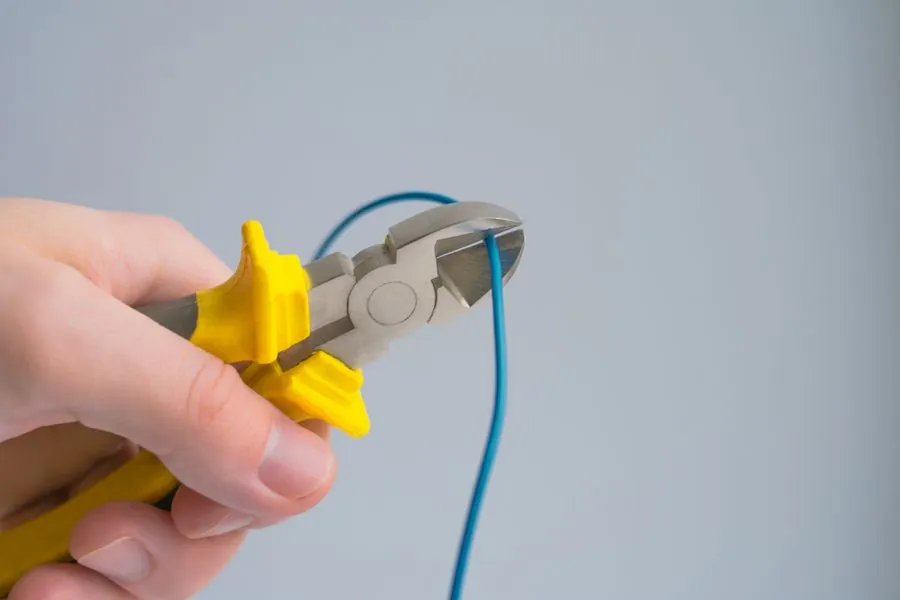 Cutting cable for new wiring (stock photo)